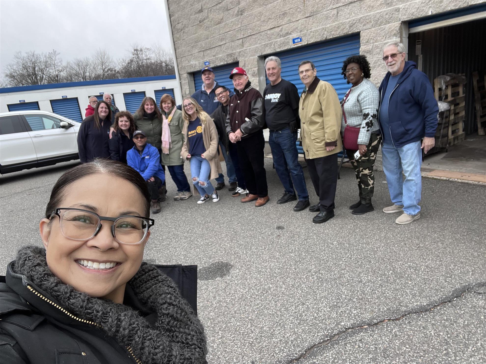 Rotarians turn out to distribute a truckload of donated food and goods to Woodbridge-area pantries, churches, and charities.