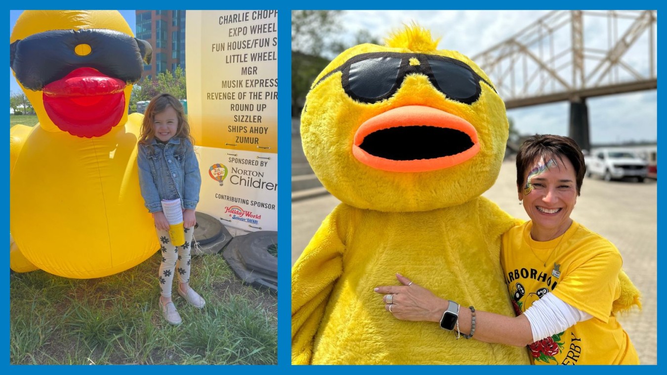 Fans posing with a giant inflatable duck and the duck mascot