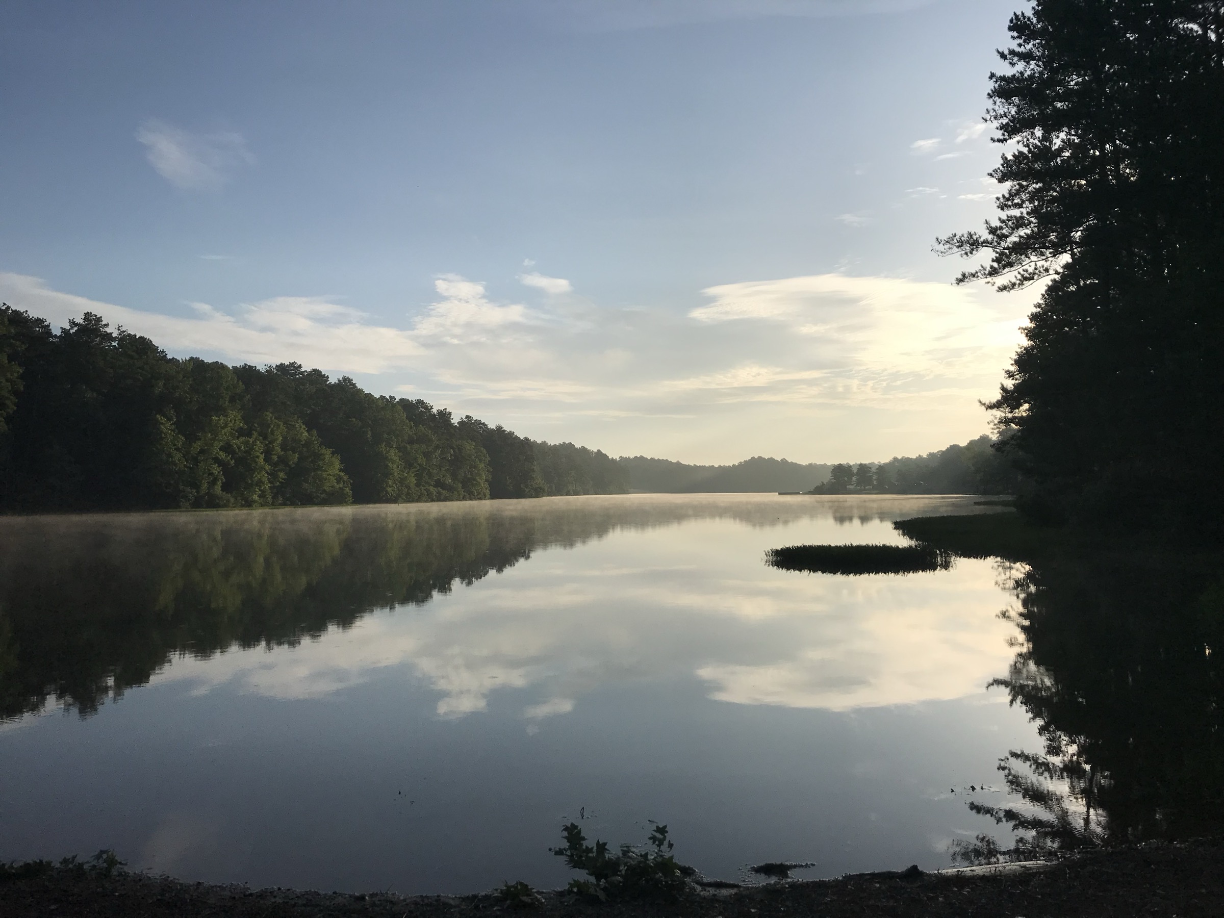 Misty sunrise over the lake at Oak Mountain State Park